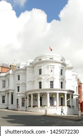 Isle Of Man UK. House Of Keys. The Tynwald Or Parliament Building In Douglas, Former Bank. To Left Is Government Offices Building And To Right The Legislative Building. Flying The Manx Flag.