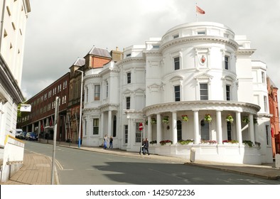 Isle Of Man UK. House Of Keys. The Tynwald Or Parliament Building In Douglas, Former Bank. To Left Is Government Offices Building And To Right The Legislative Building. Flying The Manx Flag.