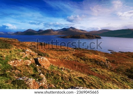 The Isle of Mull coastline at Acharonich, looking out over the small isle of Eorsa to the Ben More mountains