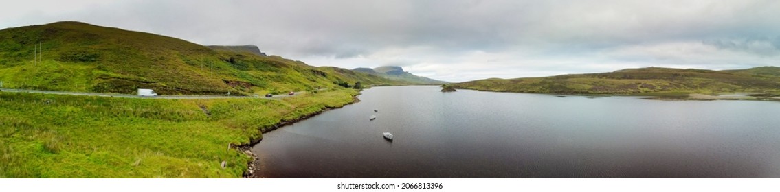 Isle of Skye, Scotland - September 7, 2021:  Aerial stitched panorama of Loch Fada and the Old Man of Storr, Isle of Skye, Scotland