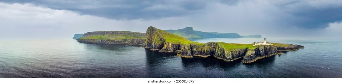 Isle of Skye, Scotland - September 8, 2021:  Overcast skies and gathering storm over Point of Neist Light House, Isle of Skye, Scotland