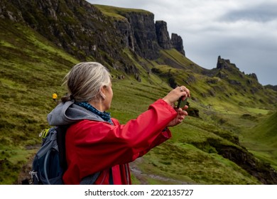 Isle Of Skyec , Scotland - August 2nd 2022 - Hiker Hiking The Quirang Trail On The Isle Of Skye During Summer