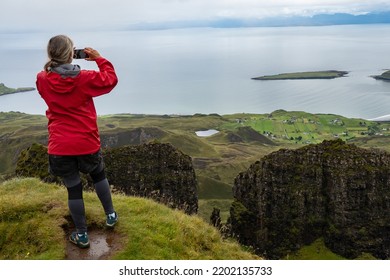 Isle Of Skyec , Scotland - August 2nd 2022 - Hiker Hiking The Quirang Trail On The Isle Of Skye During Summer