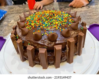 Islip Terrace, NY, USA, 8.21.22 - The Close Up View Of A Homemade Cake That Is Decorated With Kit Kats And Hersey Kisses.