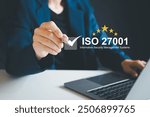 ISO 27001 concept. Businesswoman with ISO 27001 certified for information security management system (ISMS). requirements, certification, management, standards