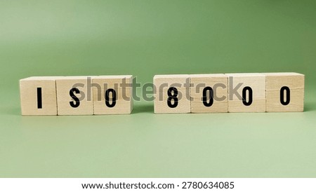 ISO 8000 data quality management standard concept with white letter cubes for information governance and master data accuracy compliance. 
