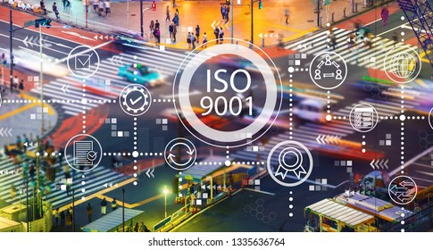 ISO 9001 With Busy City Traffic Intersection At Night