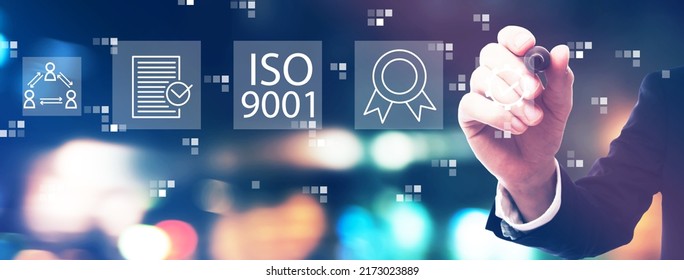 ISO 9001 Concept With Businessman On Night City Background