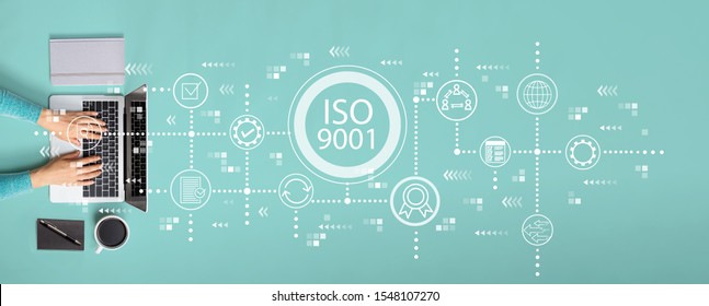 ISO 9001 concept with person using a laptop