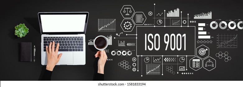 ISO 9001 concept with person using a laptop computer