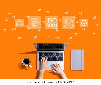 ISO 9001 Concept With Person Using A Laptop Computer