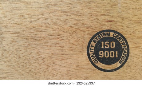 ISO 9001, Quality System Certification,on Wood Background,