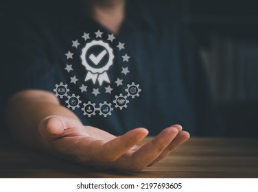 ISO Certification Concept. Hand Showing The Excellent Standard Score With Ribbon After Passed The Evaluation Or Certified Audit In Organization Or Factory Or Company To Guarantee The Service Quality. 