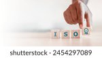 ISO quality control certification concept. wooden cubes with the abbreviation ISO with a check mark.