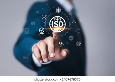 ISO standards quality control. Businessman touching virtual quality assurance or guarantee product. ISO Standard certification. Modern ISO banner.