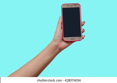 (isolate With Clipping Path) Female Hand Holding A Smart Phone Mobile On Pink Case With Black Screen On Pastel Cyan Blue Green Background.