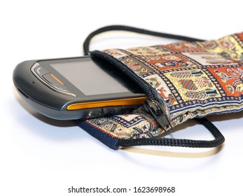 Isolate View Of A Mobile Phone In An Oriental Embroidered Bag