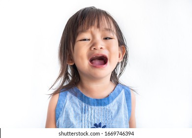 Soft​ focus.​ Portrait​ image​ of​ baby​ 2-3​ years​ old.​ Sad​ Asian​ child​ girl​ crying.​ On​ white​ background​ isolated.