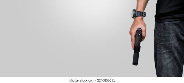 Isolated 9mm pistol gun holding in right hand of gun shooter with clipping paths, copy space.
