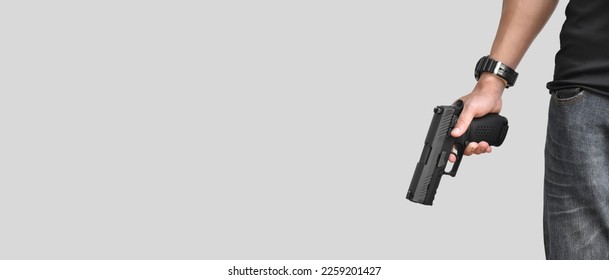 Isolated 9mm pistol gun holding in right hand of gun shooter with clipping paths.