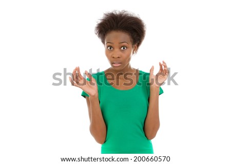 Isolated african american girl in green afraid and amazed over white.