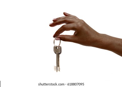 Isolated african female hand holds keys on white background.