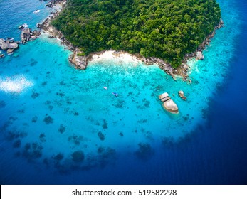 Isolated Beautiful Tropical Island With White Sand Beach And Blue Clear Water And Granite Stones. Top View, Speedboats Above Coral Reef. Similan Islands, Thailand.