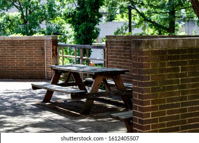 Isolated bench with bricks and foliage growing - Shutterstock ID 1612405507