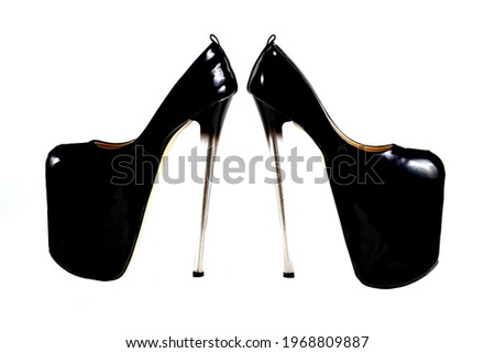 isolated black shoes threesome strips on very high heels on a white background. Shoes for strip plastic, pole dance, exotic. Beautiful closed stiletto heels.