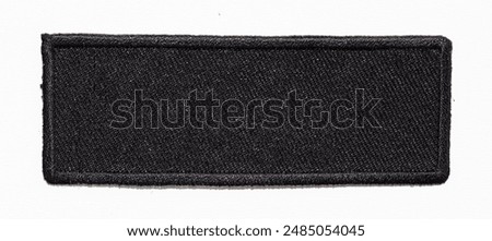 Isolated blank black rectangle patch with black trim.