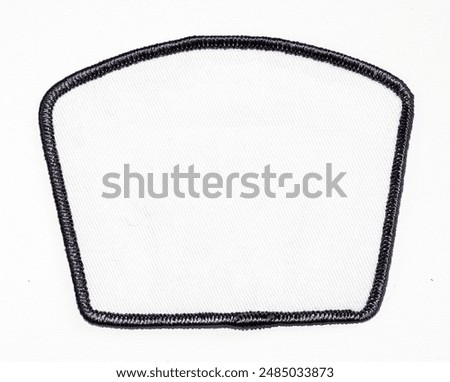 Isolated blank white patch with black trim.