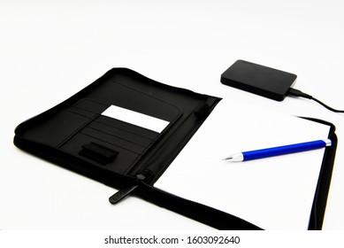 isolated block notes with pen and external hd