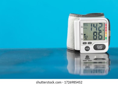 Isolated Blood Pressure Apparatus On A Blue Background.