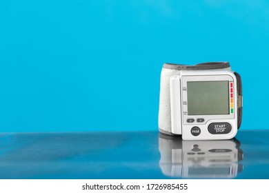 Isolated Blood Pressure Apparatus On A Blue Background.