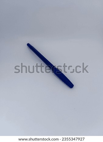 Isolated the blue pen used by a school student with a white background