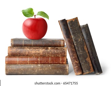 Isolated books. Stack of old books and red apple on top of it isolated on white background