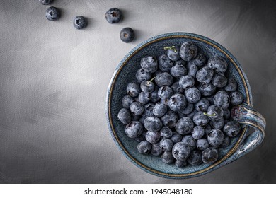 Isolated Bowl Of Blueberries In A Vintage Serving Dish. Above Shot, Dark Background.