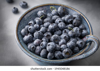 Isolated Bowl Of Blueberries In A Vintage Serving Dish. Above Shot, Dark Background.