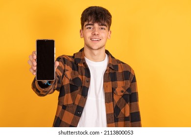 isolated boy with mobile phone or cell phone in background - Powered by Shutterstock