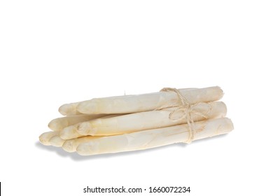 Isolated bunch of white asparagus tied with a spring, lying on white background