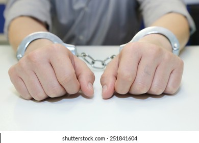 isolated business man arrested with handcuffs