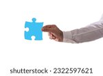 Isolated businessman holds a piace of puzzle. Concept teamwork, partnership, integration
