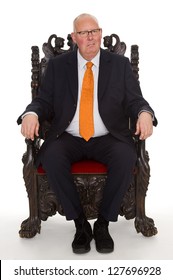 Isolated Businessman Sitting On A Throne