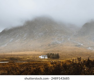 Isolated Cabin at the Foot of a Mountain in the Autumnal Scottish Highlands - Powered by Shutterstock