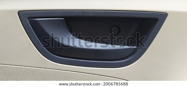 isolated car\
inside door opening black lock opening handle background texture.\
horizontal closeup macro side\
view.