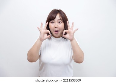 Isolated Chubby Asian Woman With OK Gesture