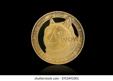 Isolated with clipping path, the golden DOGE Coin symbol close up. Doge coin is one of the digital currency - cryptocurrency driven by blockchain technology.