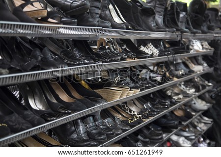Isolated Close, Horizontal Left Side View Point Womens Black Colored Pumps, Shoes, Sandals, Thrift Store Shelves - Copy Space Use Overlay for Text
