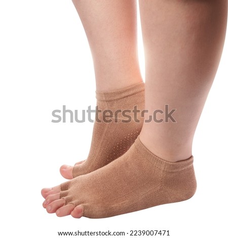 Isolated close-up woman wearing yoga socks with open toes