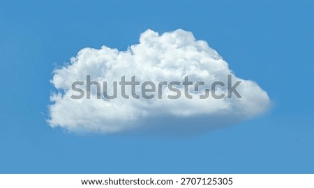 Isolated cloud floating in the wind against blue background. Big glowing massive cumulus spreading on the deep blue sky sunny day. Nature concept background. Elegant landscape soft image